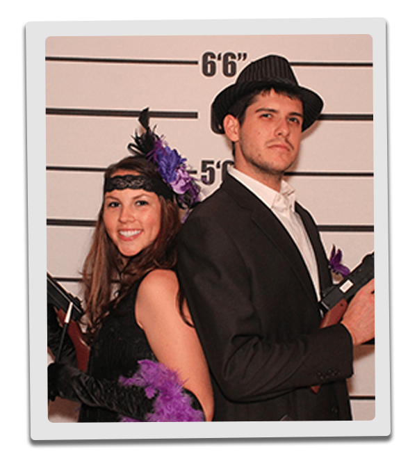 New York Murder Mystery party guests pose for mugshots