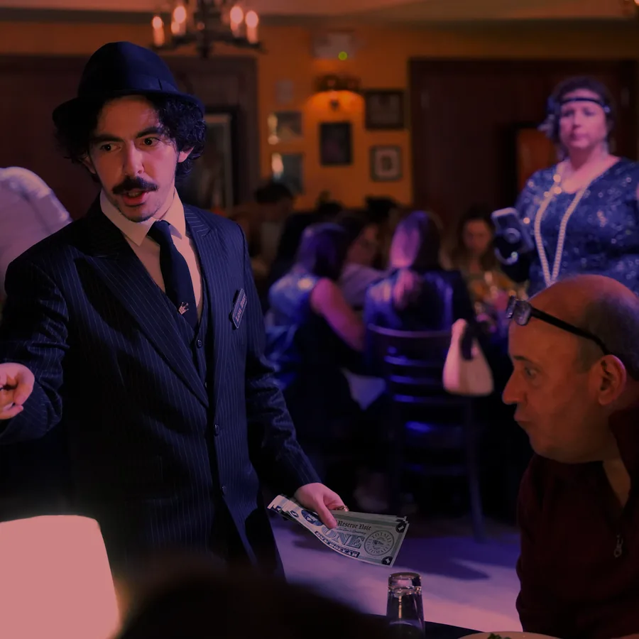 A Murder Mystery Company actor working the room at a New York show