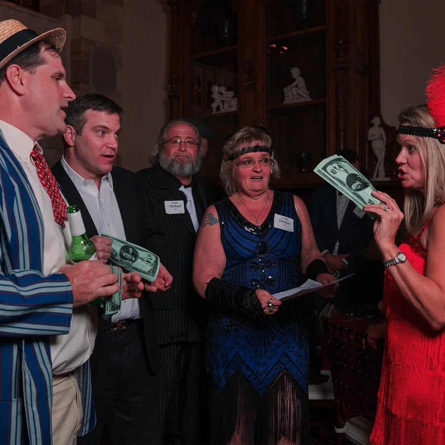 Guests at a Murder Mystery Company public dinner show in New York